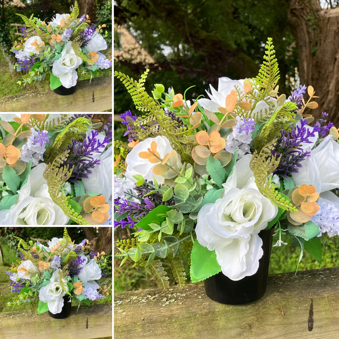 grave pot with flowers featuring artificial silk blooms