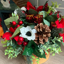 a christmas red & white flower arrangement in gold hat box