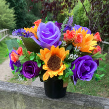 grave pot with faux silk roses and sunflowers