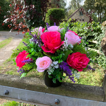 graveside artificial flower arrangement in shades of pink