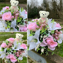a grave pot with roses and lilies plus flocked teddy