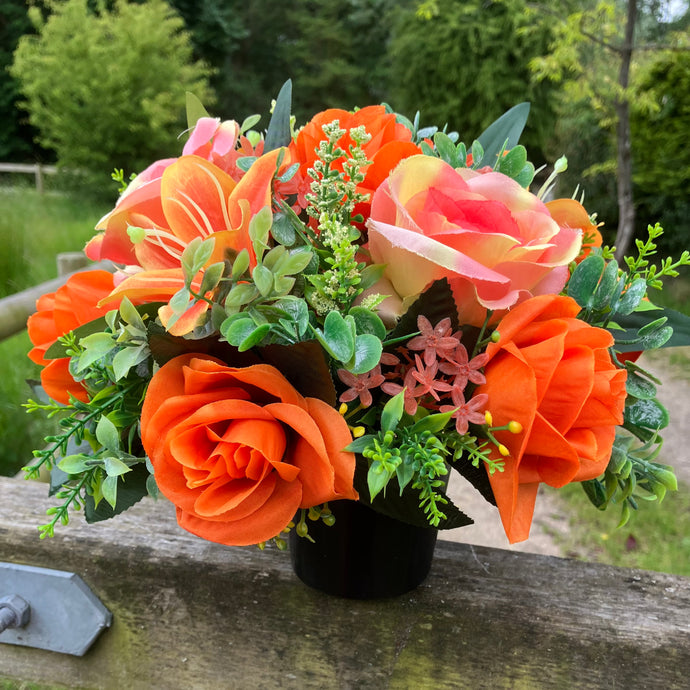 grave pot with roses lilies and tulips