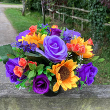 grave pot with faux silk roses and sunflowers