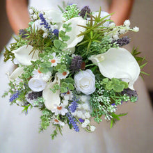 A brides bouquet of white calla, roses, lavender and foliage