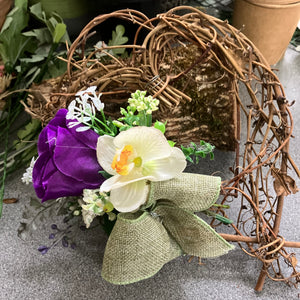 A heart wreath with flower arrangement