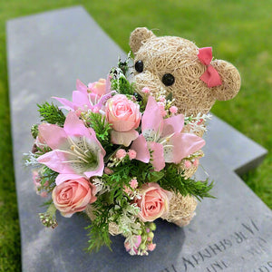 Child graveside memorial teddy with pink or yellow/blue/cream flowers