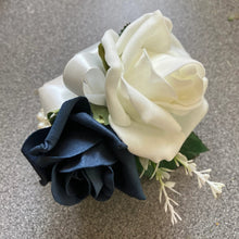 a wedding corsage featuring artificial flowers