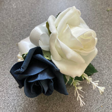 A teardrop bouquet of navy and ivory artificial roses flowers