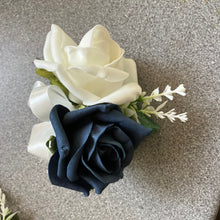 A teardrop bouquet of navy and ivory artificial roses flowers