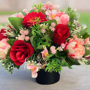 faux silk memorial flower arrangment in grave pot