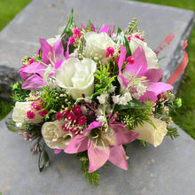 A memorial Flower Arrangement of pink flowers