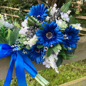 A teardrop wedding bouquet collection of gerbera and daisies