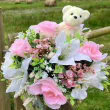 a grave pot with roses and lilies plus flocked teddy