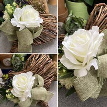 A heart wreath with faux roses and foliage