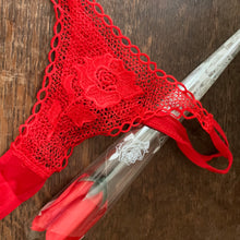 Red lace g string brief wrapped to look like a single red Rose