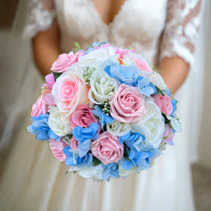 brides wedding bouquet of artificial ivory,blue and pink rose flowers with diamantes