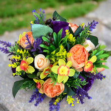 a grave pot with flowers featuring  artificial silk blooms