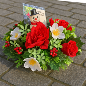 A graveside posy flower arrangement in grave pot