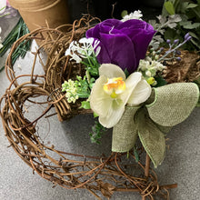 A heart wreath with flower arrangement