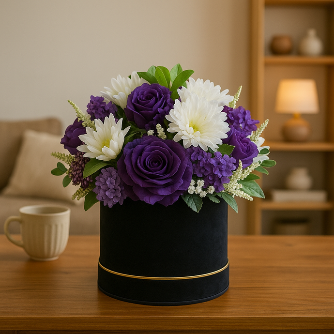 hat box full of artificial purple and ivory flowers