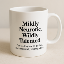 White mug with black text on a beige background