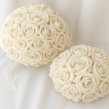 A wedding bouquet collection of ivory foam roses with diamante centres