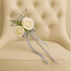 A bridesmaids star wand with white roses & silver ribbon handle