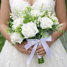 a wedding bouquet collection of white or ivory roses & lily of the valley