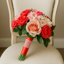 Bouquet of coral and pink roses on a decorative chair