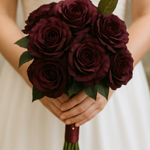 A wedding bouquet of artificial silk burgundy rose flowers for brides and bridesmaids