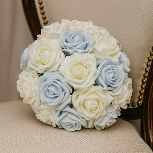 Bouquet of light blue and white roses on a beige chair