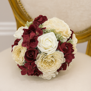 a wedding bouquet of cream, ivory & burgundy artificial roses & hydrangea