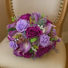 artificial wedding bouquet of purple silk flowers