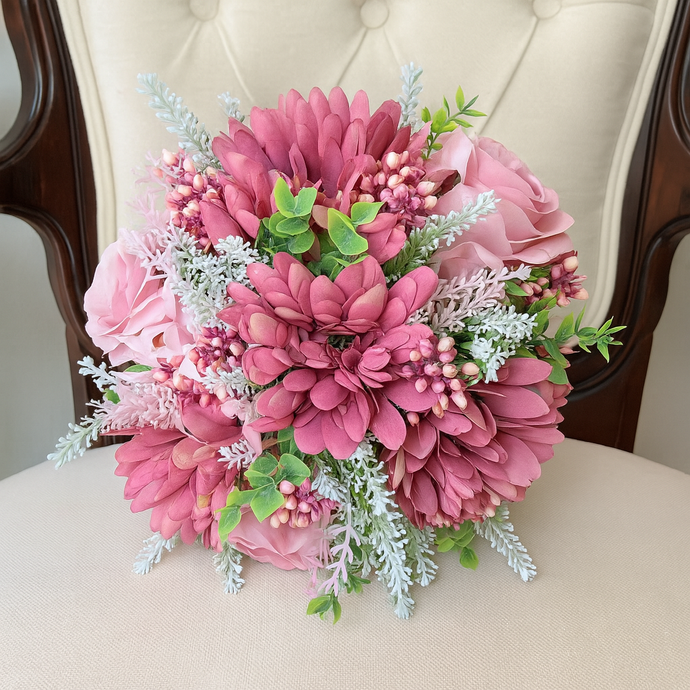 A brides posy featuring artificial pink silk gerbera and roses