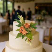 A dusky orange autumn artificial flower cake topper