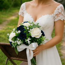 A teardrop bouquet of navy and ivory artificial roses flowers
