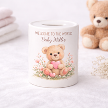Personalised teddy Money Box holding a cerise pink heart