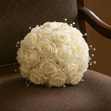 a wedding bouquet collection featuring ivory rose flowers with crystal strands