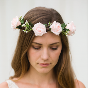 a flower crown of pale pink artificial rose flowers