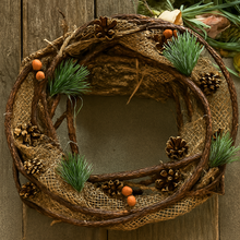 Decorative wreath with natural elements on a wooden door
