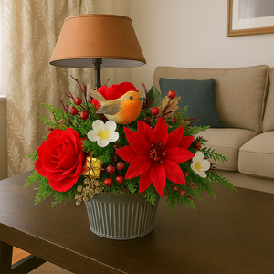 Decorative flower arrangement with red flowers and a bird figurine on a table in a living room.