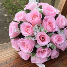 A wedding bouquet collection featuring pink roses and gyp