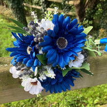 A teardrop wedding bouquet collection of gerbera and daisies