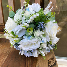 a bridal bouquet of artificial silk ivory, White & blue flowers