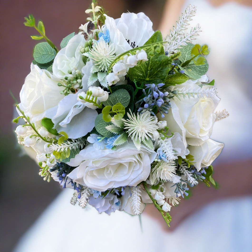 a bridal bouquet of artificial silk ivory, White & blue flowers