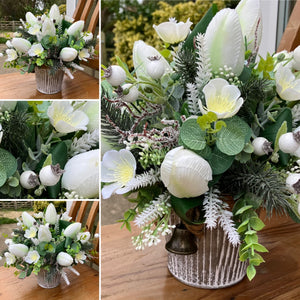 A Christmas flower arrangement featuring artificial flowers