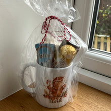 a christmas ceramic mug, hot chocolate marsh mallows, chocolate & sweets