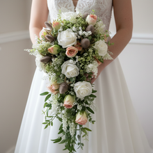 A wedding bouquet of artificial white and pink rose flowers