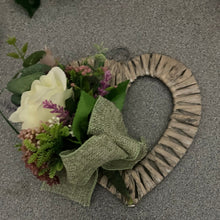A heart wreath with silk of roses and foliage