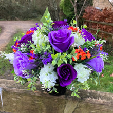 Artificial graveside flowers arrangement in black pot